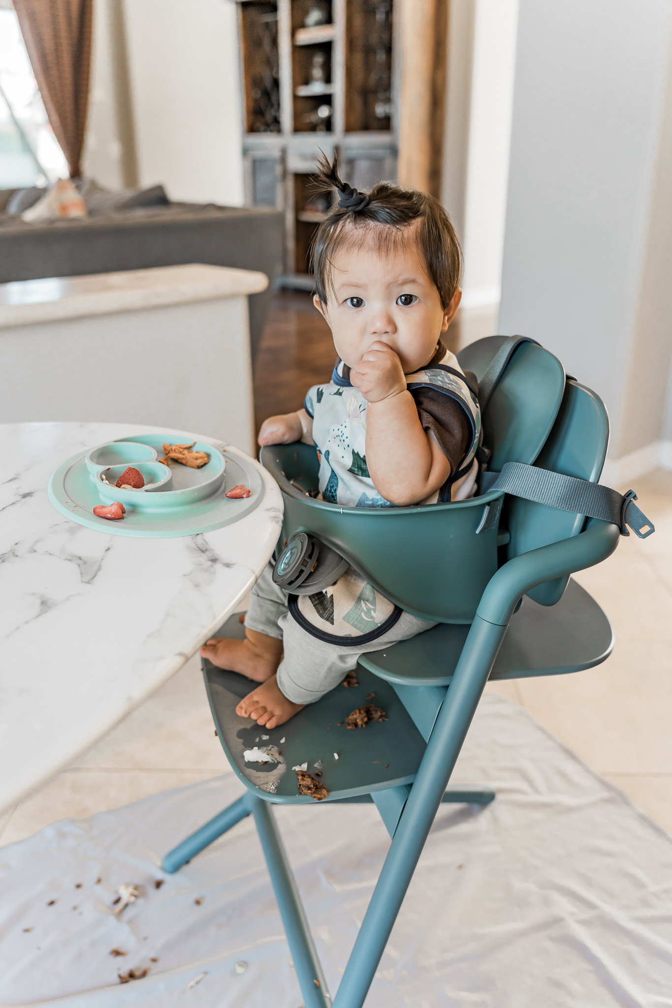 Happy baby eating solid foods