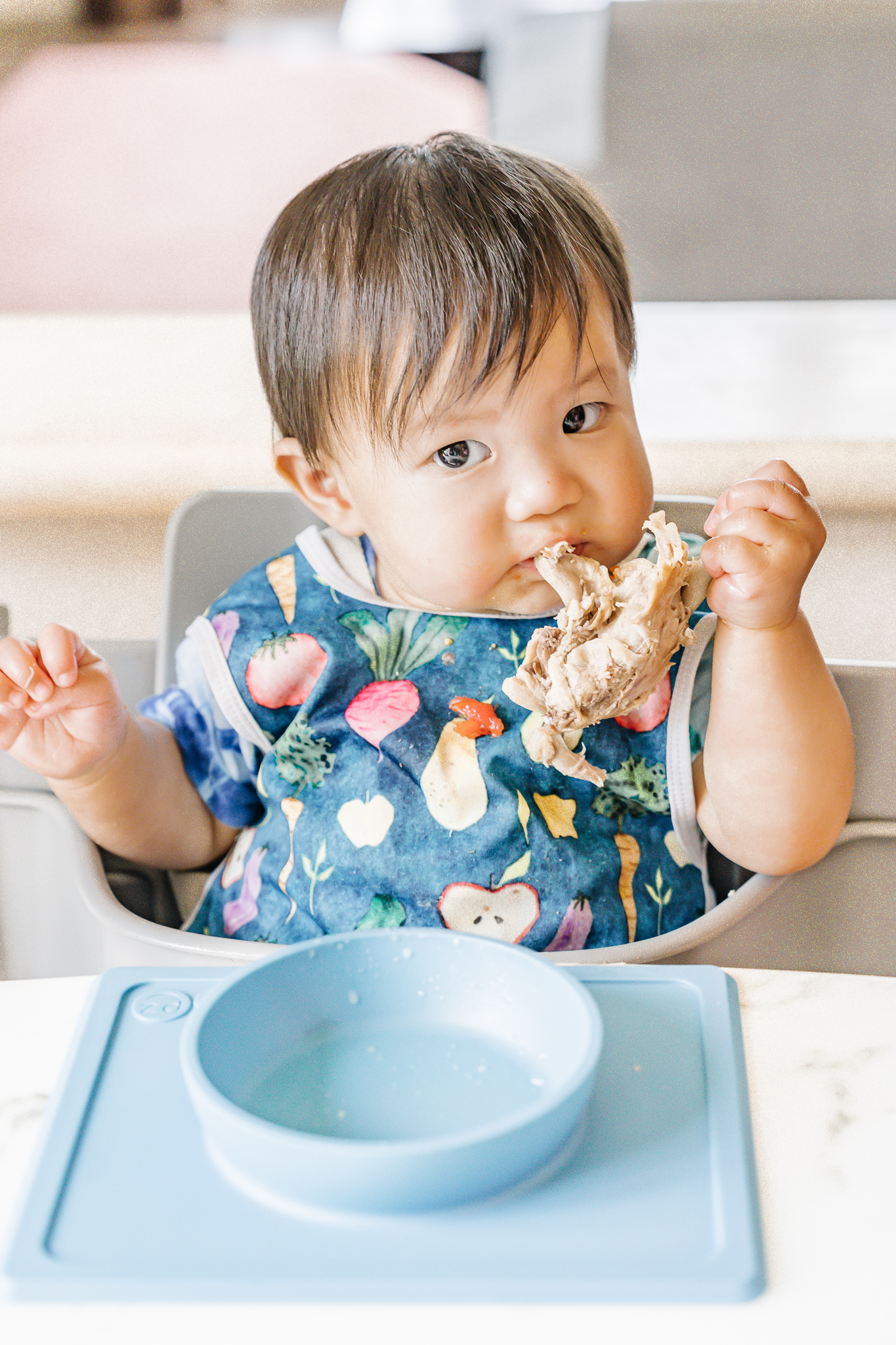Baby self-feeding in high chair