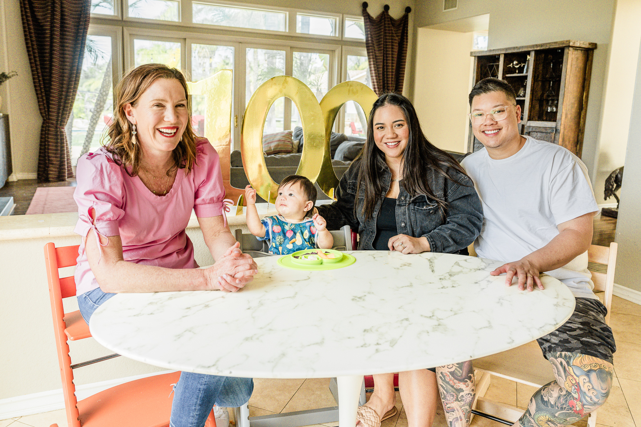 Katie Ferraro with family and baby at table